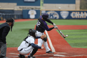 college baseball batter hitting ball with catcher anticipating pitch