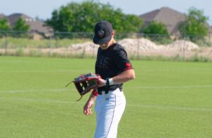 baseball player checking gorout electronic pitch calling system