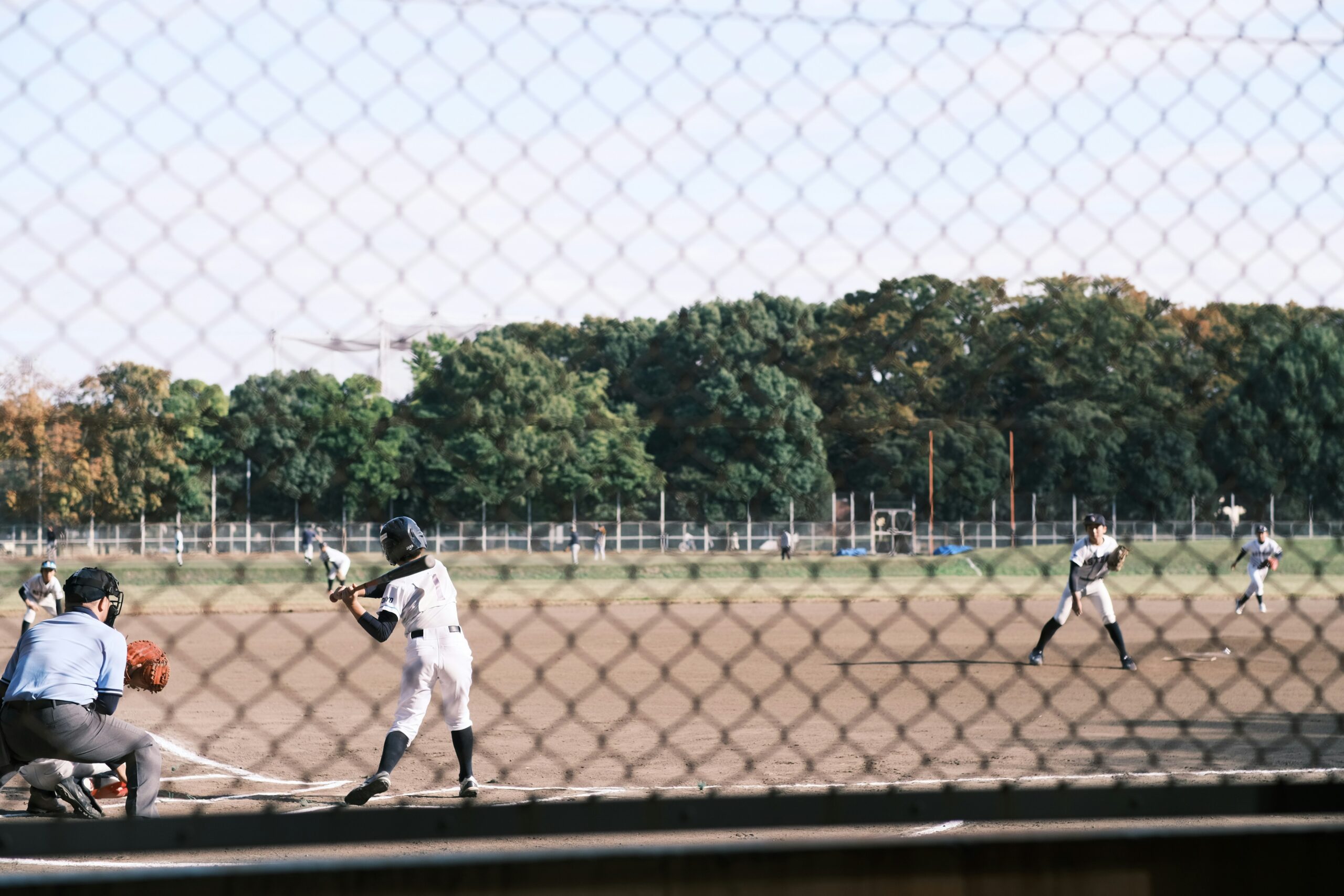 umpire calling pitch in youth baseball game