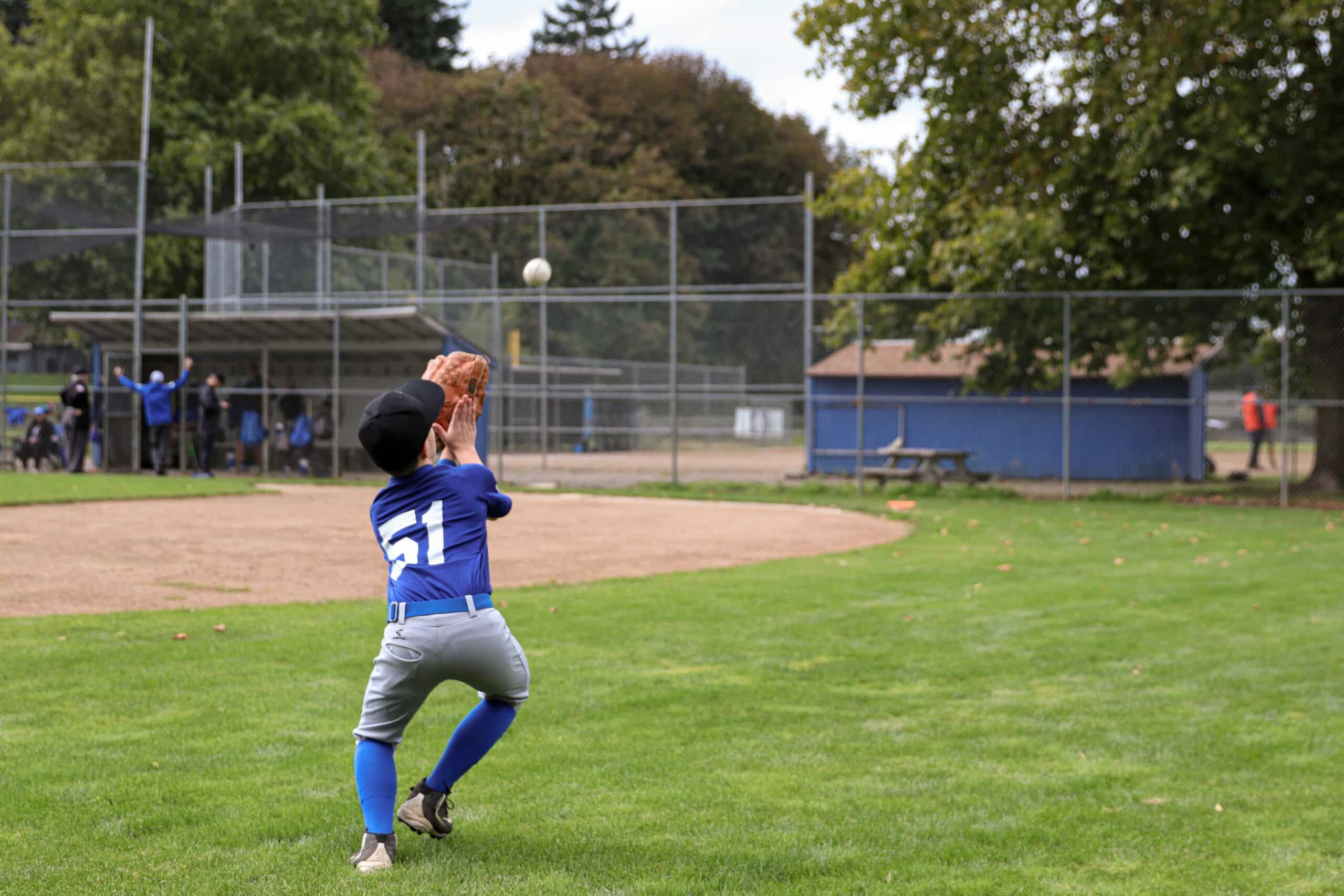 baseball player catching pop up in drill