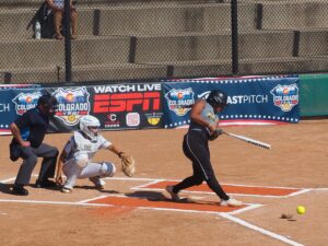 softball batter hits ground ball to first base