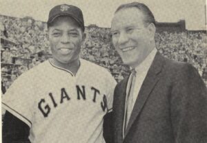 willie mays posing for photo