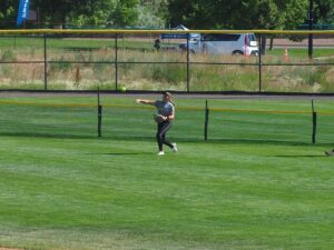 softball center fielder throwing ball