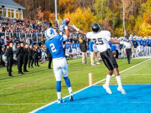 football wide receiver making toe touch catch
