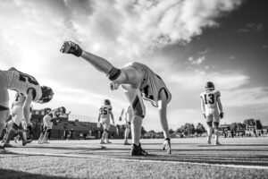 football wide receivers stretching