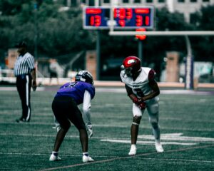football wide receiver lined up on line of scrimmage