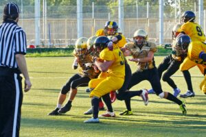 football player making tackle