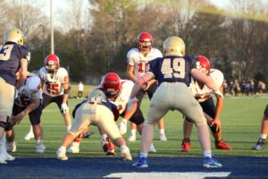 football defense looking at quarterback