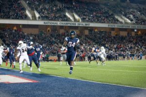 football player scoring touchdown