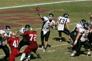 football quarterback throws ball
