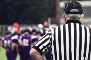 referee watching football game