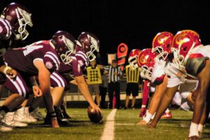 football offensive line at snap