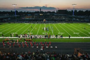 wide shot of a football field at night